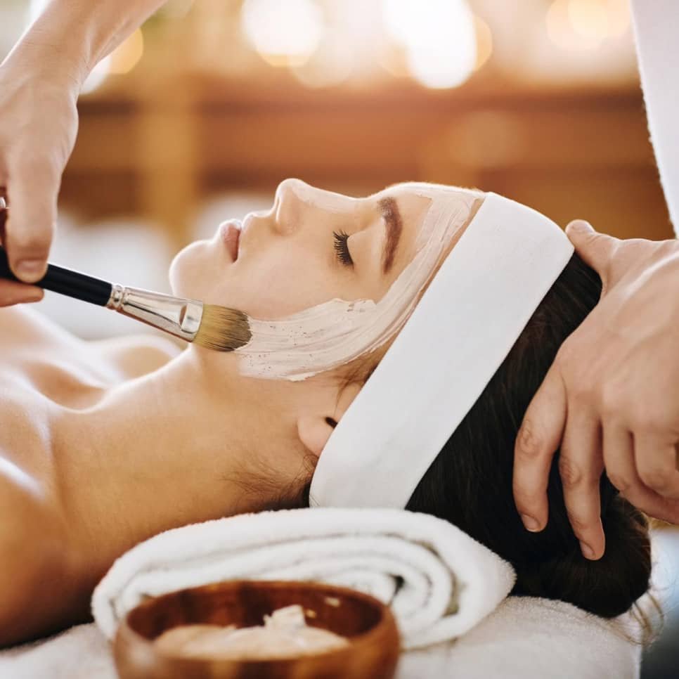 Client receiving a relaxing luxury facial treatment at Clara Medical Spa in Santa Clara